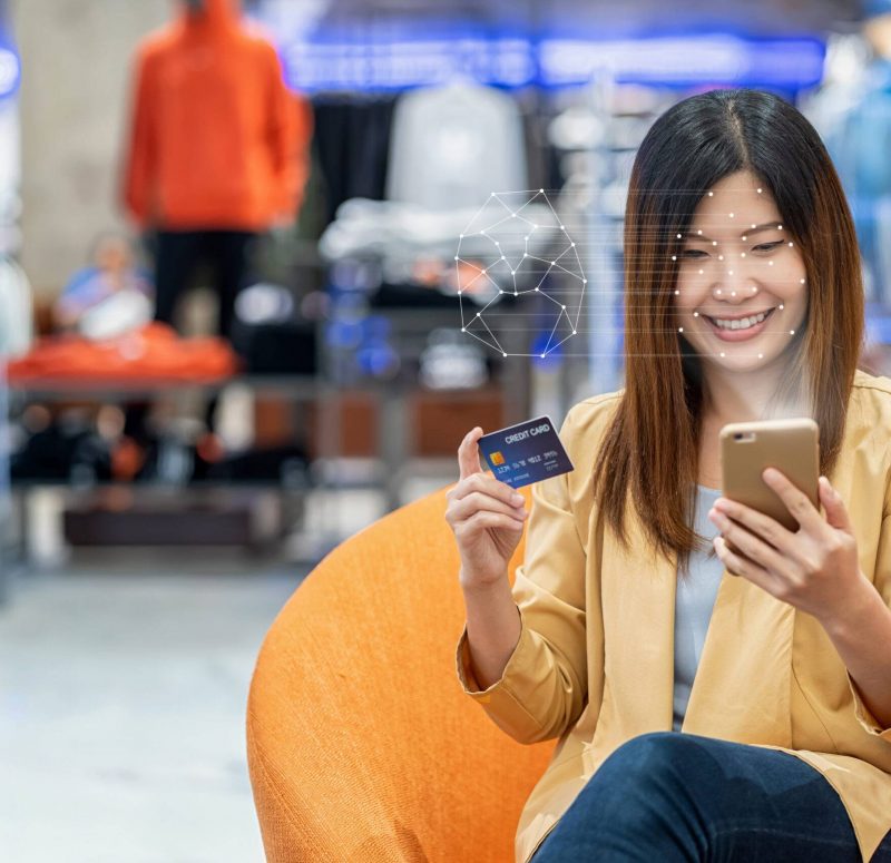 Asian women using the technology tablet for access control by face recognition in private identification step when online shopping with the credit card, credit card mockup, online payment concept,